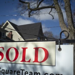 A real estate sold sign is shown in a Toronto west end neighbourhood May 16, 2020. THE CANADIAN PRESS/Graeme Roy