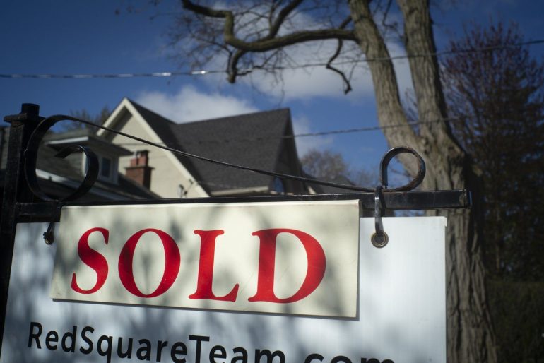 A real estate sold sign is shown in a Toronto west end neighbourhood May 16, 2020. THE CANADIAN PRESS/Graeme Roy